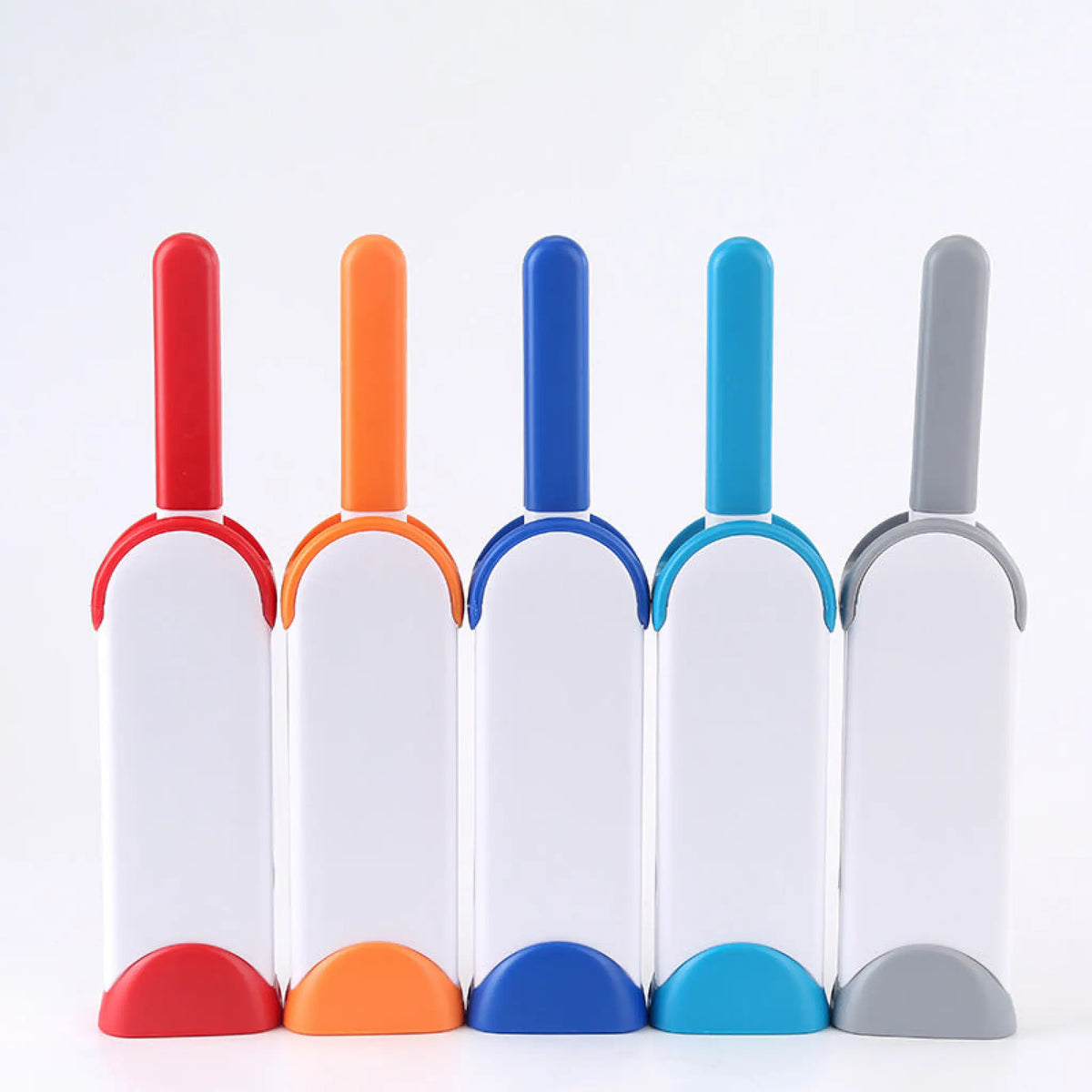 Five reusable pet hair remover brushes with self-cleaning bases in red, orange, blue, light blue and gray