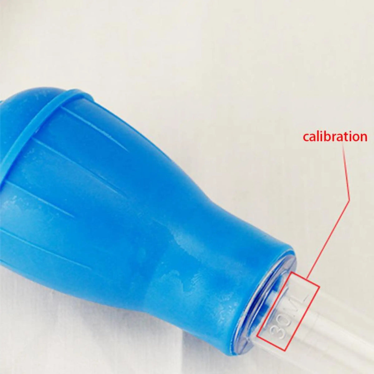 Aquarium siphon pipette with blue bulb and transparent tube detail