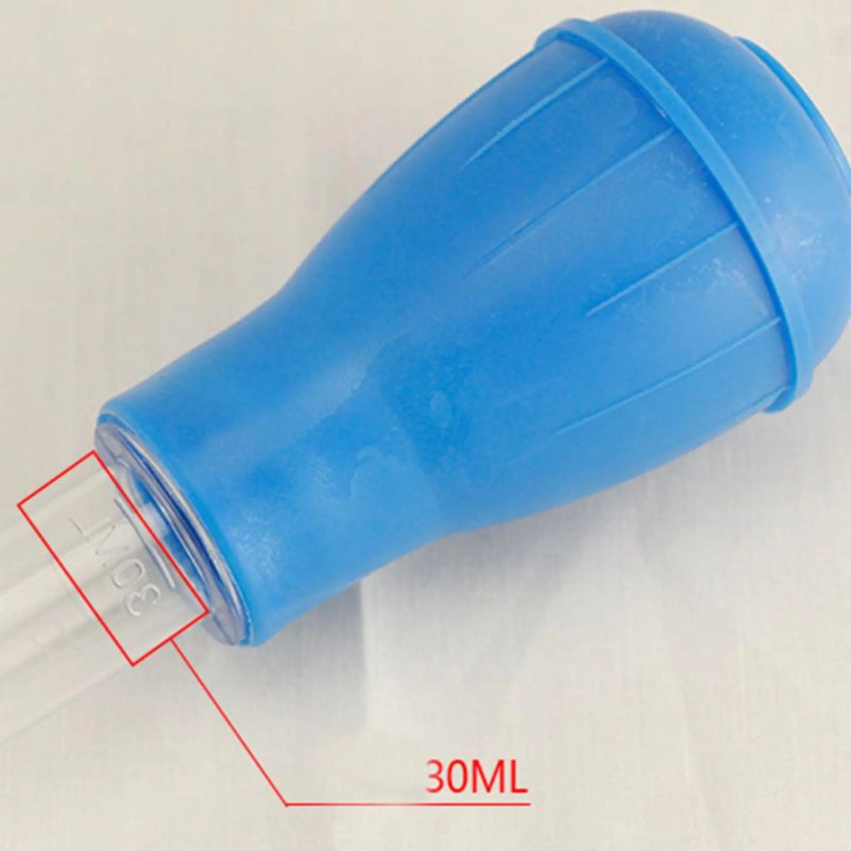 Close-up of blue bulb with 30 ml capacity marking on aquarium siphon tube