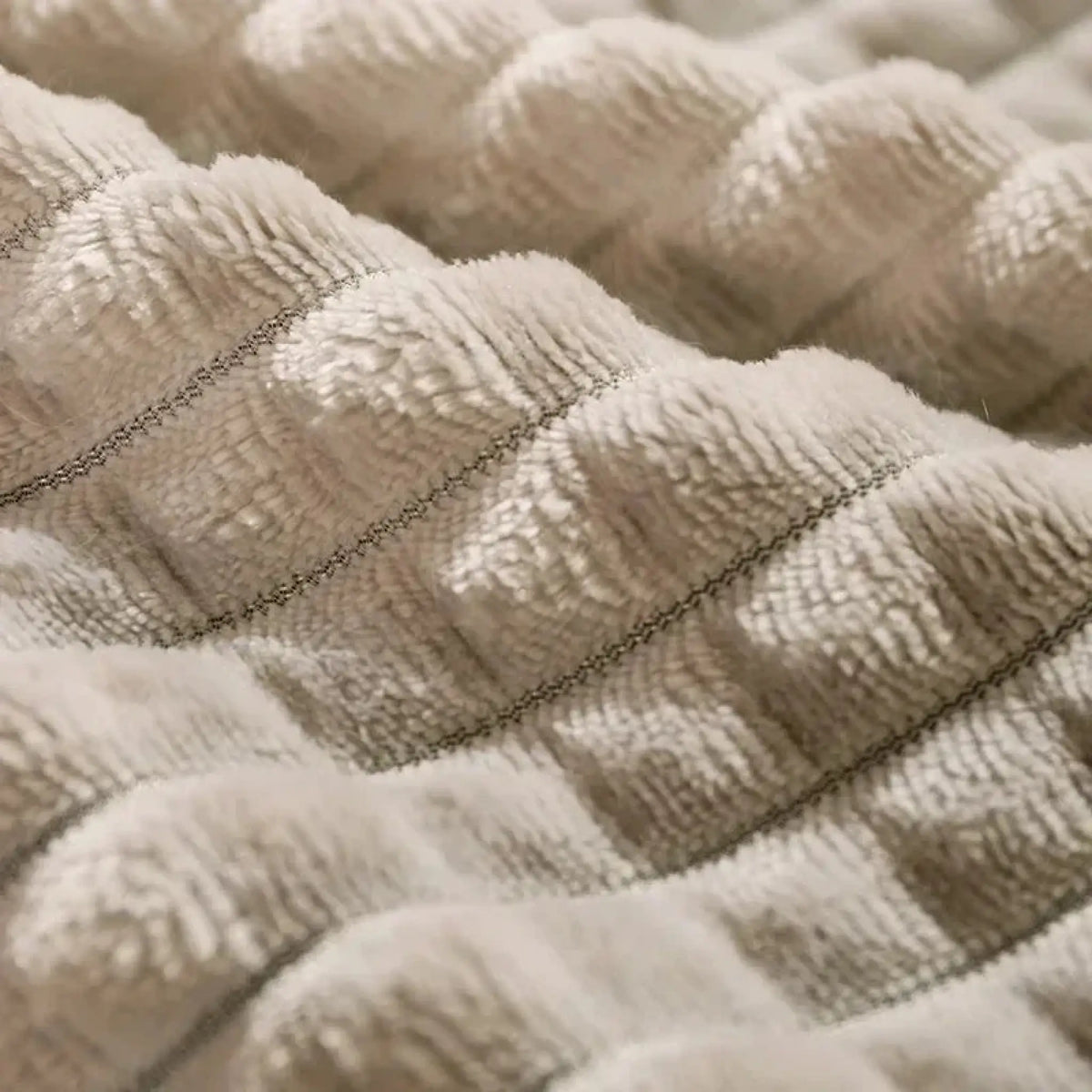 Close-up of soft plush quilted fleece fabric texture of the pet bed