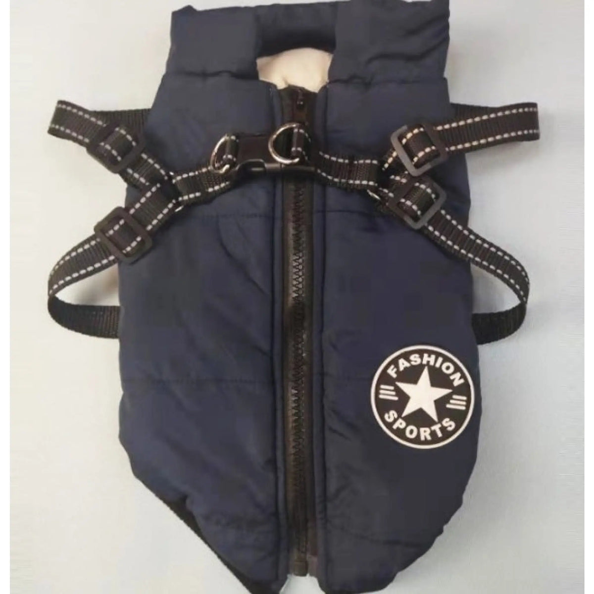 Navy blue padded dog coat with reflective harness straps and zip front