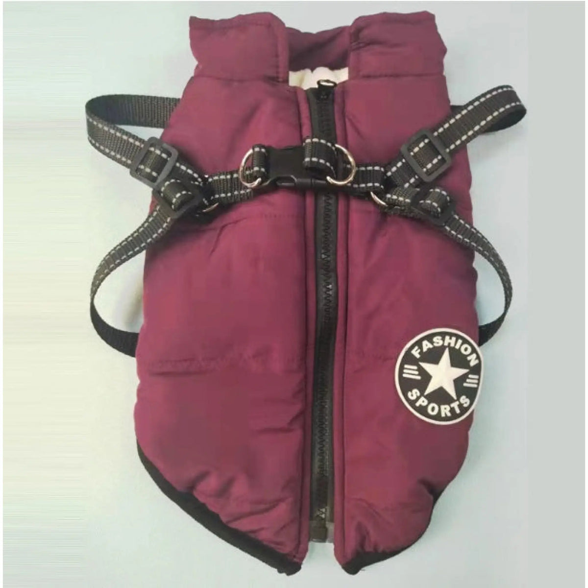 Burgundy padded dog coat with black trim and reflective harness straps