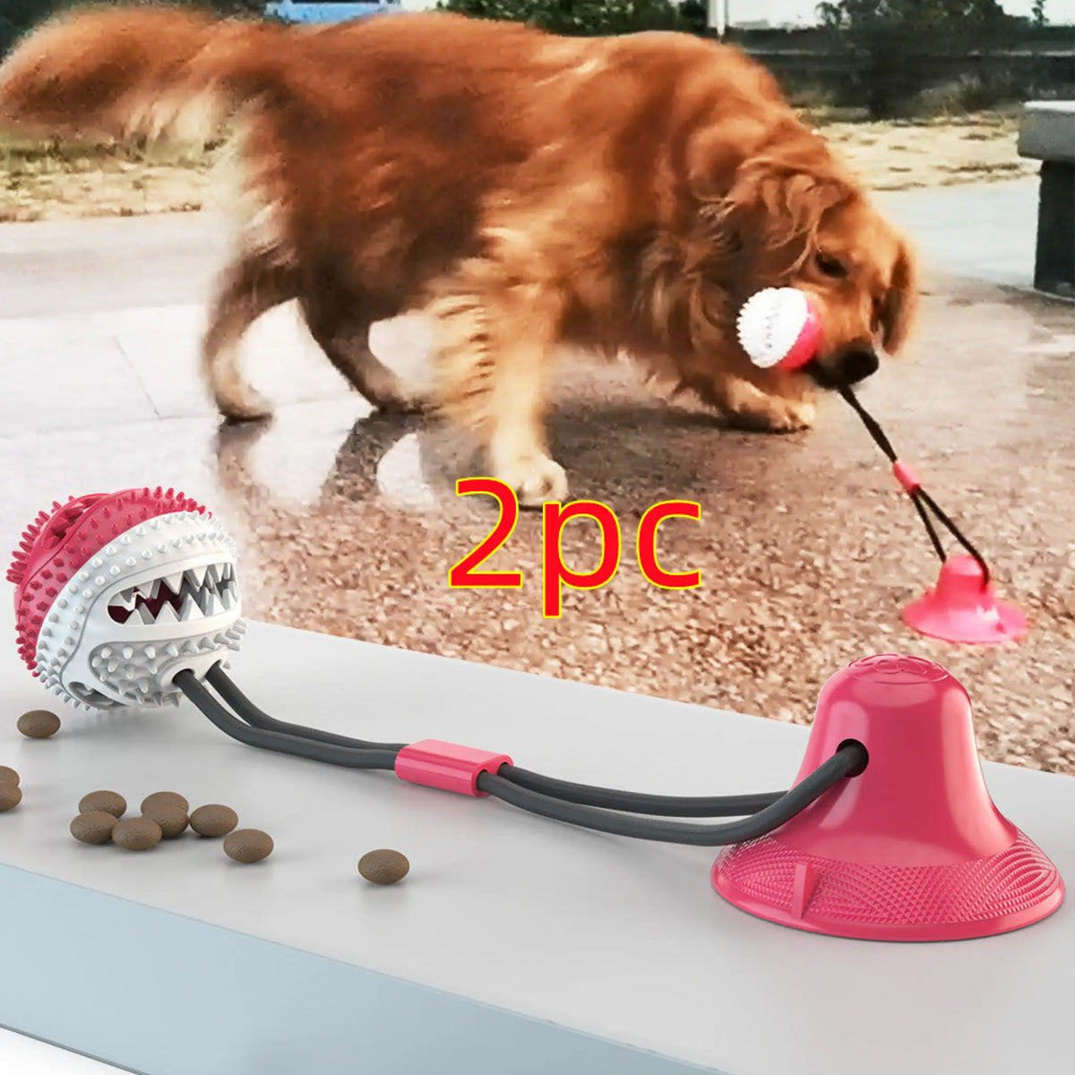 Pink suction cup dog tug toy with treat ball shown with a golden retriever playing outdoors